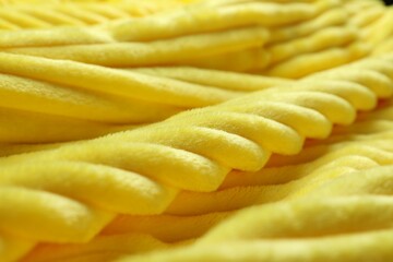 Bright yellow soft woolen fabric, closeup view