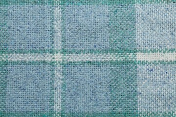 Fototapeta premium Turquoise woolen fabric with geometrical pattern as background, top view