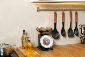 Retro mechanical kitchen scale, other utensils and spices indoors