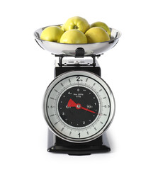 Retro mechanical kitchen scale with apples isolated on white
