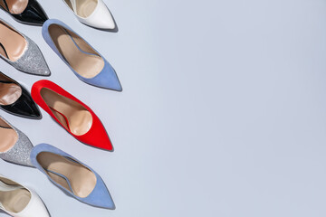 High heeled shoes on light background, flat lay. Space for text