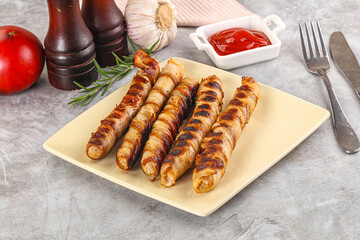 Grilled meat sausages wrapped bacon