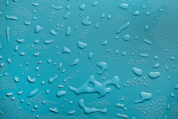 Beautiful background of drop of water on turquoise background.