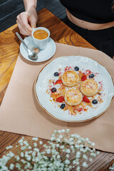 A fresh and delicious breakfast of cheesecakes and porridge