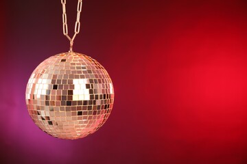 Obraz premium Shiny disco ball on color gradient background. Space for text