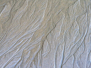 Patterns and textures on a sandy beach