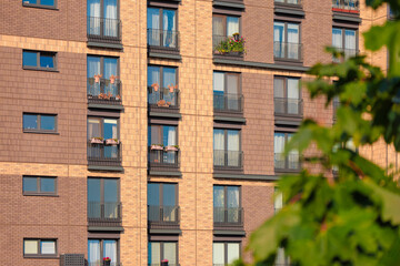 Modern buildings, walls and windows. City view on a sunny day. 