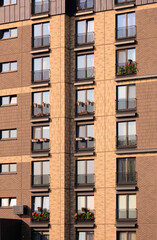 Modern buildings, walls and windows. City view on a sunny day. 