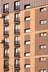 City view on a sunny day. Modern buildings, walls and windows. 