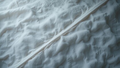 Obraz premium Textured white fabric close-up studio shoot textile detail soft lighting aesthetic perspective fashion concept