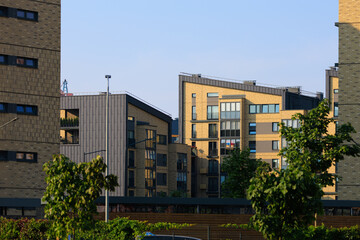 Cityscape on a summer day, modern buildings and houses 