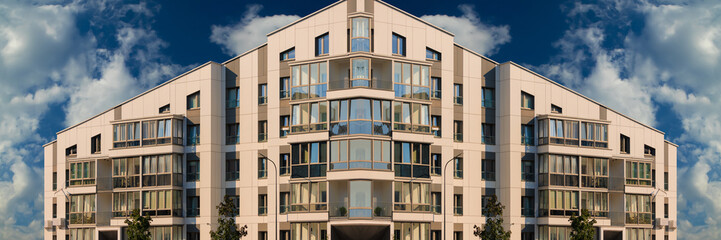 City view on a sunny day. Modern buildings, walls and windows. 