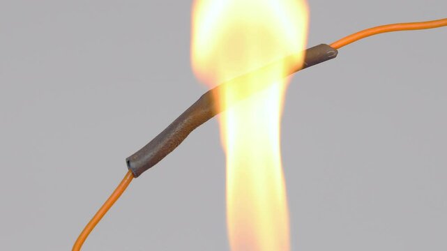 Overheating the black shrink tubing using a lighter flame.