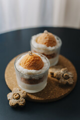 Beautiful cute candles in a glass decorated with cookies. Cosy warm home atmosphere.