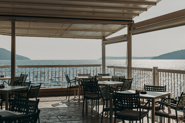 Empty cafe in Herceg Novi in a beautiful sunny day, Montenegro. Amazing view of Adriatic sea.