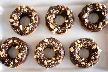 Healthy gluten-free donuts covered in chocolate and almonds, Mallorca, Balearic Islands, Spain