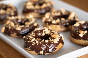 Healthy gluten-free donuts covered in chocolate and almonds, Mallorca, Balearic Islands, Spain