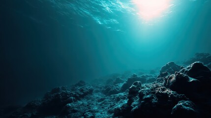 Beneath the surface, blue light penetrates the water, creating a serene atmosphere. Natural rock formations and marine textures offer a glimpse into underwater life, evoking tranquility