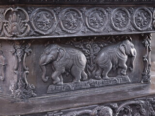 The Intricate Elephant Carvings that Adorn the Base of a Decorative Monument are Truly Stunning