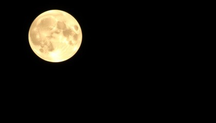 Obraz premium High-resolution image of a brightly lit full moon, isolated on a pure black background, astronomy, radiant