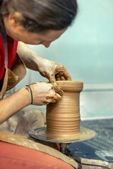 Master male potter making a vase. Pottery. Clay modeling. Creating ceramics.