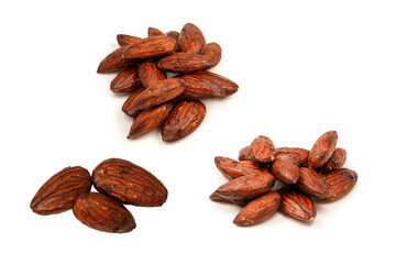 A group of caramelized almonds isolated on a white background.