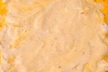Yellow sauce splashes as a background.