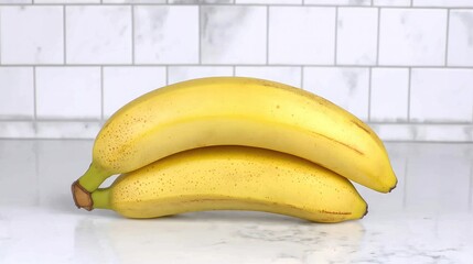 Two ripe bananas on a countertop