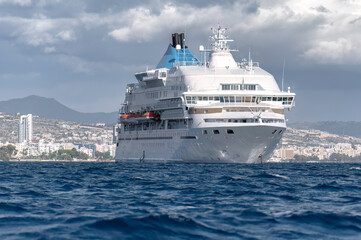 Cruise ship sailing near Limassol coastline on a cloudy day. Cyprus