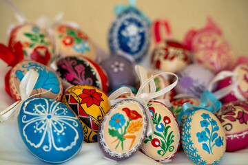 A bunch of colorful Easter eggs with flowers and designs on them

