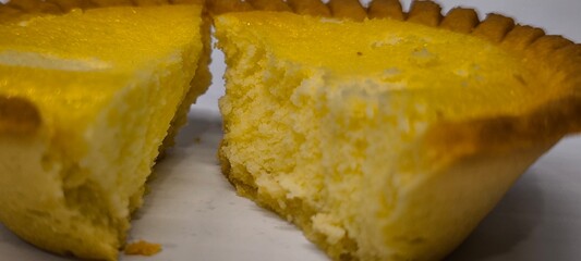 Egg tarts that are crispy on the outside and soft on the inside. Egg tarts that have a rich and creamy egg aroma. Egg tarts on white background.