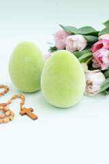 Green Easter eggs with chicken and fresh tulips, Christian Easter concept