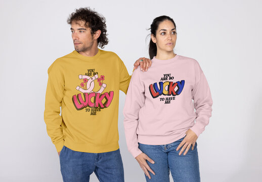 Stylish Couple Wearing Cozy Pullovers Indoors