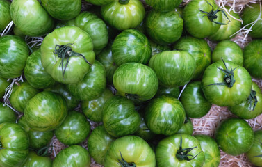 Fresh raw green tomatoes top view background