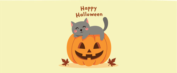 adorable gray kitten resting on an jack-o'-lantern