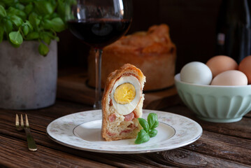 Casatiello napoletano - Italian stuffed festive homemade Easter savory bread with salami, cheese...