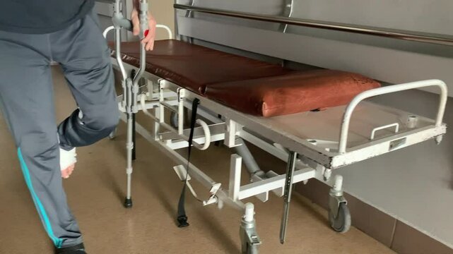 Man with a broken leg is being treated in hospital.