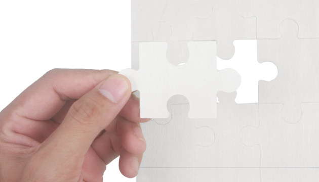 Puzzle piece insertion home office visual content indoor close-up problem solving concept