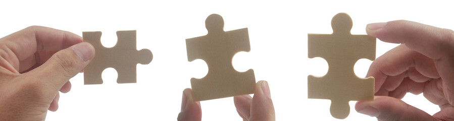 Assembling puzzle pieces collaborative workshop visual learning minimalist studio close-up creativity in action