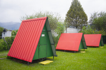 three camps with zinc roofs.