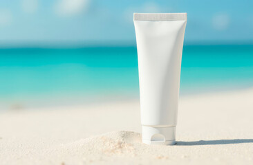 A tube of white cream on the sand, against the backdrop of the sea