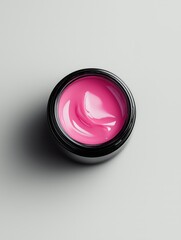 pink beauty product in black jar on neutral background