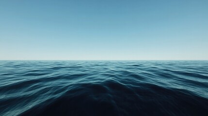 Obraz premium Calm ocean waves reflect clear blue skies, creating serene horiz