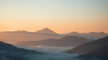 Obraz premium Ultra HD scenic view of mountain peaks glowing at sunrise, soft pastel sky above misty layers below. Elegant, minimal, and peaceful—ideal for nature or landscape visuals