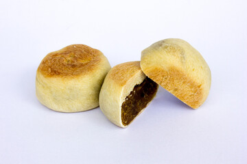 Bakpia pathok , Indonesian Traditional Cake with Chinese Influence. It made from a mixture of green beans, cheese and sugar, which is wrapped in flour, then baked.