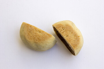 Bakpia pathok , Indonesian Traditional Cake with Chinese Influence. It made from a mixture of green beans, cheese and sugar, which is wrapped in flour, then baked.