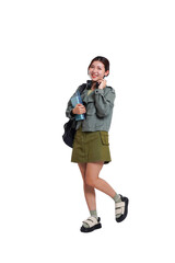 Naklejka premium Portrait of Asian female student wearing backpack, headphones, fashionable clothes, posing dynamically on white background 