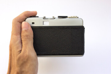 Vintage silver analog camera isolated on white, retro technology.