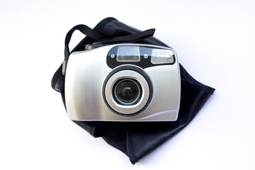Vintage silver analog camera isolated on white, retro technology.