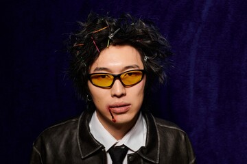 Fototapeta premium Spring fashion showcase featuring a stylish man in a vibrant studio setting